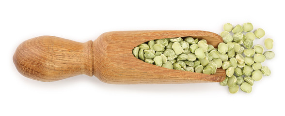 Green split peas in a wooden scoop isolated on white background. Top view