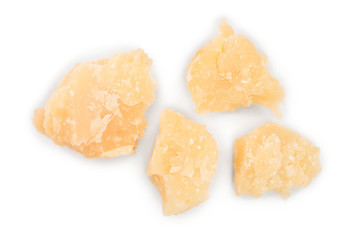 Parmesan cheese pieces isolated on white background. Closeup. Top view. Flat lay