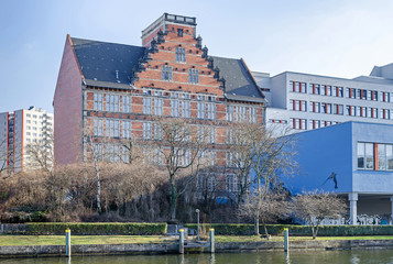 Spree river embankment  Holsteiner Ufer with buildings of a  Gymnasium school in Berlin, Germany