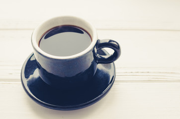 Coffee cup and saucer on white background