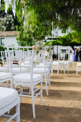flowers in chairs wedding decoration