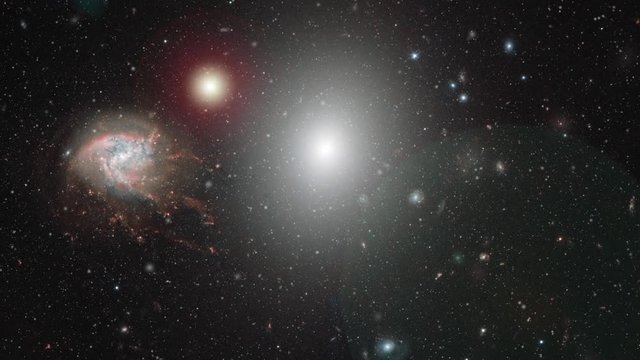 Coma cluster, large galaxies cluster in outer space rotating on star field moving flare light. Contains public domain image by Nasa