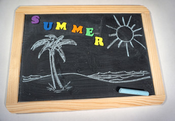 Summer design on chalkboard with palm tree and beach