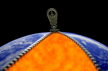 World peace, illustrated by Earth-like fabric ball with opened zipper revealing fire and peace symbol in zipper-pull. Globe image from NASA.