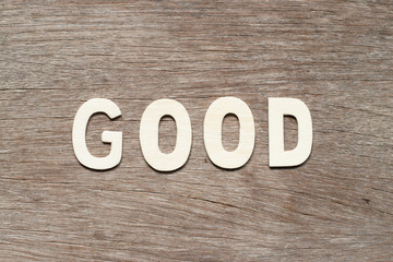 Obraz premium Alphabet letter in word good on wood background