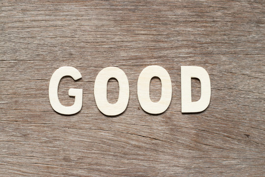 Alphabet letter in word good on wood background