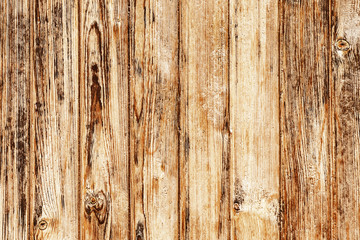 Rustic country wood wall. Antique brown wooden desks with knots.