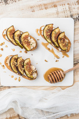 Swedish toasts with figs, cheese, rosemary, honey and walnuts