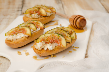 Swedish toasts with figs, cheese, rosemary, honey and walnuts