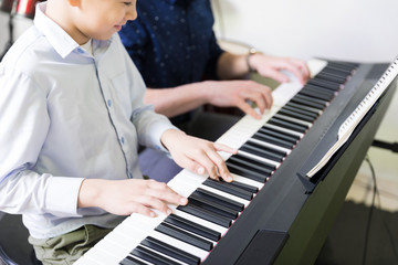 Kid Taking Piano Lessons From Pianist