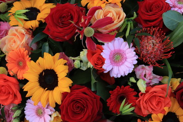 Wedding arrangement in red, orange, yellow