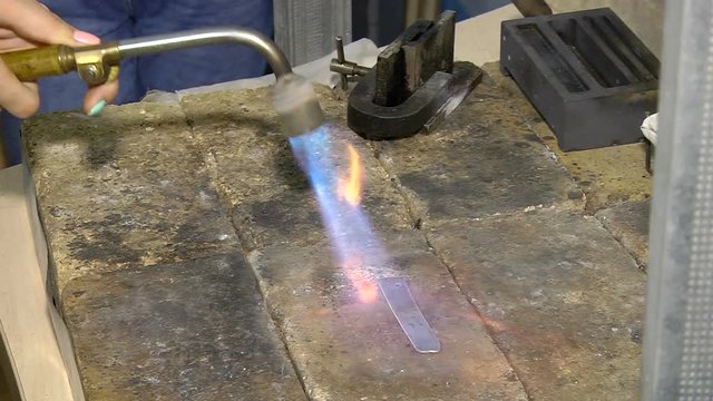 Heating of a silver billet with a gas burner