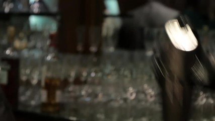 Shaking up martini before serving bar