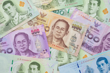 Flat lay or top view of many Thai banknotes texture background. Concept of Thai baht payment currency of Thailand, Forex investment, stock market or asia, global financial economic.