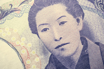 Close up macro of ichiyo higuchi on 5000 Japanese yen banknote texture background. Concept of Japanese yen payment currency of Japan, Forex investment, stock market or asia, global financial economic.