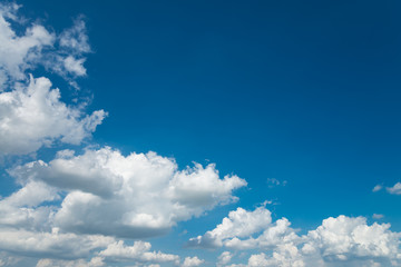 White clouds with blue sky background in sunny day. Green environmental and natural travel concept.