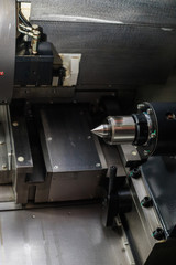 Industrial machine with a lot og small details and switches at the factory.