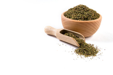 thyme herb in wooden bowl and scoop isolated on white background.copy space added