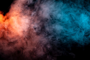 Background of orange, purple, red and blue wavy smoke on a black isolated ground. Abstract pattern of steam from vape of smoothly rising clubs. Mocap and print for t-shirt.