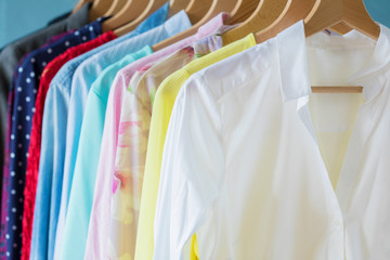 Female clothes hanging on rack