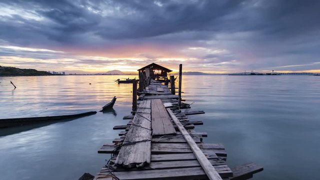 Timelapse of colourful and beautiful sunrise over awood jetty in the morning at Penang, MALAYSIA. ProRes-422