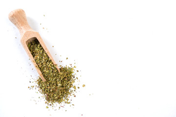 marjoram in wooden scoop isolated on white background. copy space added