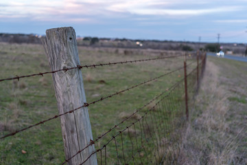 Close Up View of Wooden Fence Next to Highway