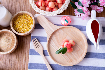 wood table with Delectable imitation fruits, Fruit Shaped Mung Beans,