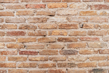 Old grunge brown stone brick wall texture abstract background.