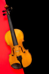 Naklejka na ściany i meble Violin on a multi-colored background, top view