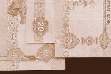 UAE dirham currency background close up. Brown color toned