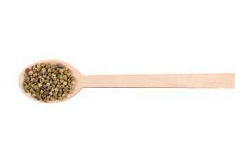 green pepper peppercorns in wooden spoon isolated on white background