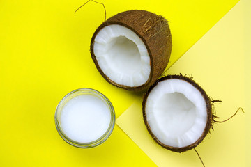 Obraz na płótnie Canvas coconut and cream jar on a yellow background