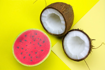 cocnut and swuishy toy melon on a vibrant yellow background
