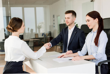 Job interview. Successful young employees working together. Business concept of co-workers in the office space.