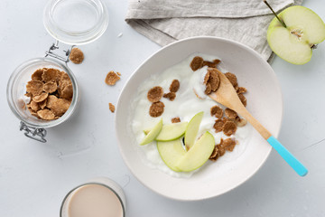 Healthy breakfast flakes oat milk apple greek yogurt