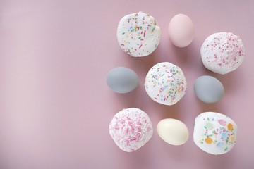 Easter food.Easter cake and eggs in pastel colors on a pink background.copy space.top view
