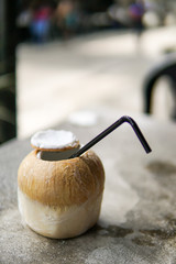 Close Up of Coconut water with blurred background and copyspace.