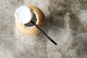 Close Up of Coconut water with blurred background and copyspace.