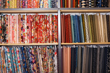 Fabric bolts on shop shelves
