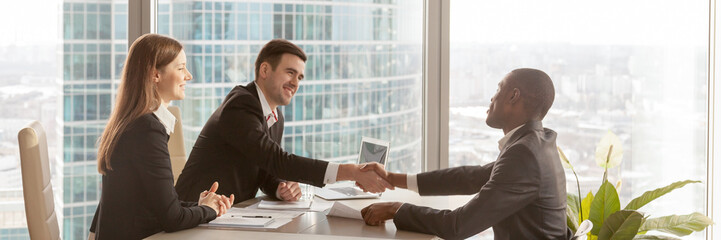 Horizontal image african boss congratulate business partner with successful negotiations 