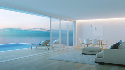 Obraz na płótnie Canvas Interior of a villa with a swimming pool. House overlooking the sea. Night. Evening lighting. 3D rendering.