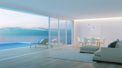 Obraz na płótnie Canvas Interior of a villa with a swimming pool. House overlooking the sea. Night. Evening lighting. 3D rendering.