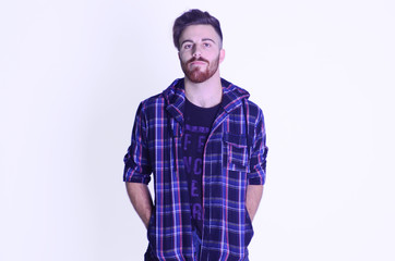 Young man posing at camera worried on isolated white background