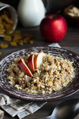 Buckwheat porridge with milk, apple, raisins and cashew nuts