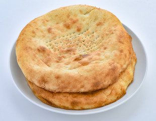 a traditional pakistani fluffy and oily bread baked in clay oven