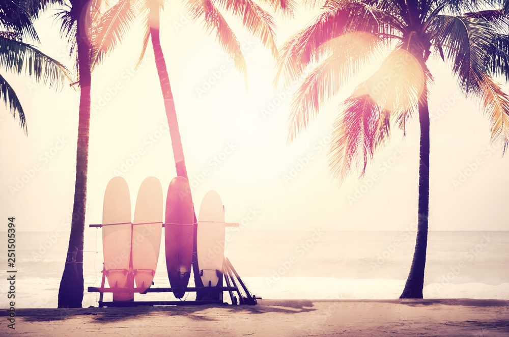 Canvas Prints surfboard and palm tree on beach background.