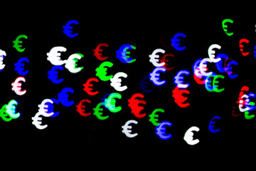 Bokeh as a Euro sign. The concept of wealth and money, trading on the stock exchange and economic growth, rich