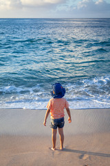 Young Boy Staring into the Ocean