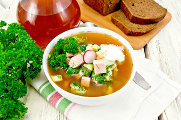 Okroshka in white bowl on napkin